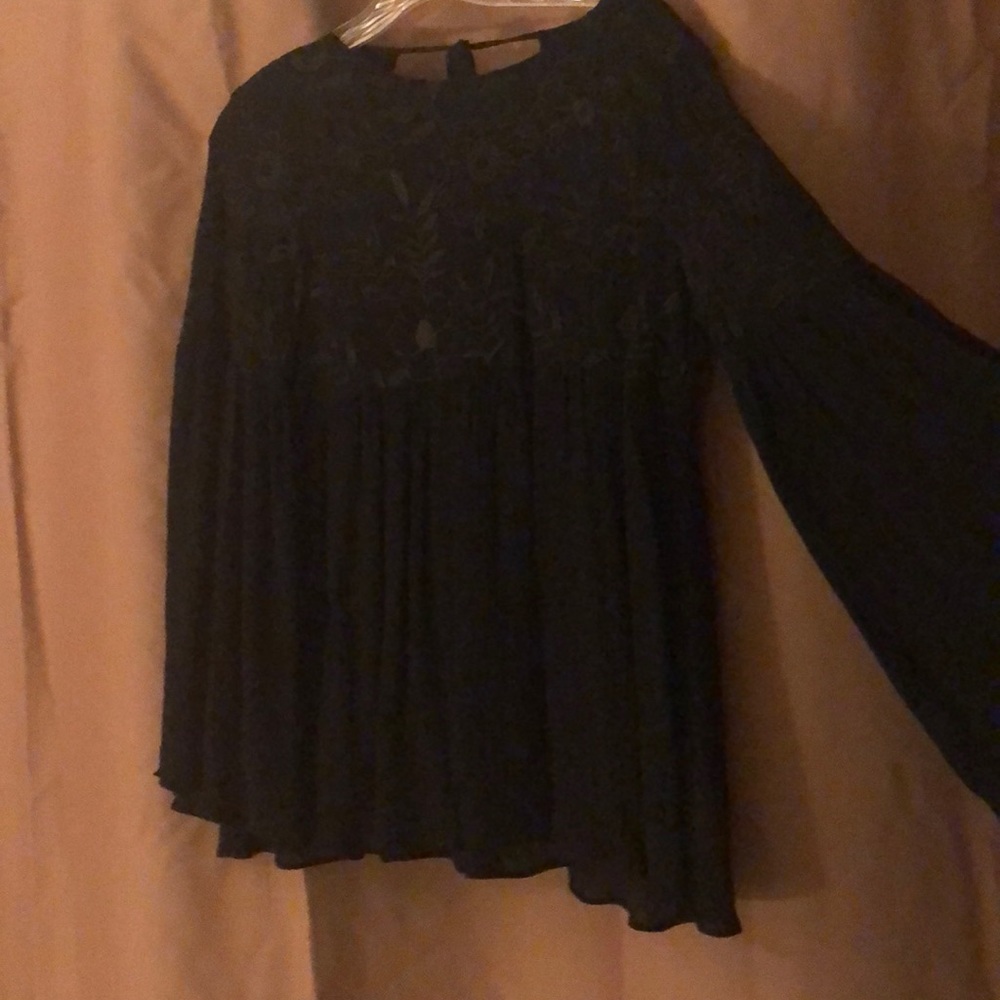 Full sleeves.  Embroidered bust.  Rayon and cotton